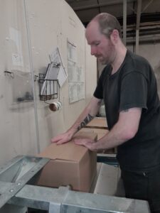 Gary at work on carton sealer